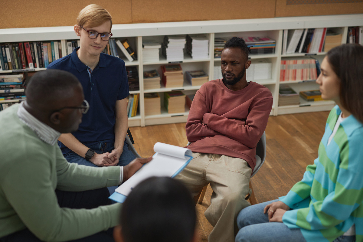 group-of-young-people-sitting-in-circle-during-the-2023-11-27-05-15-52-utc-1